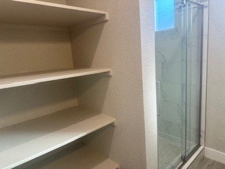 Empty white shelves in a room.