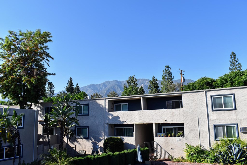 exterior building photo at Americana La Crescenta with mountain view behind
