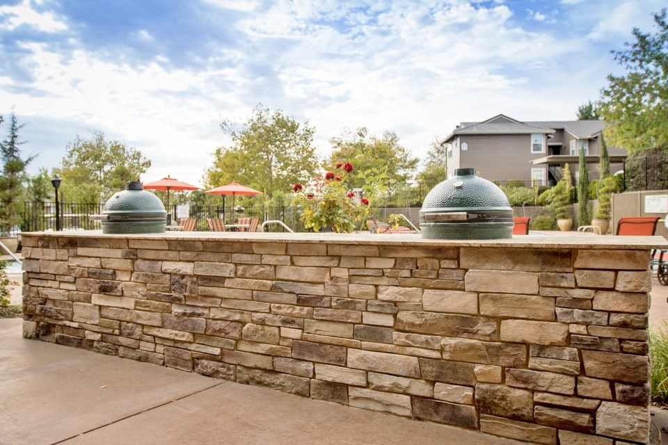 View of community grilling station with counter space to prep food
