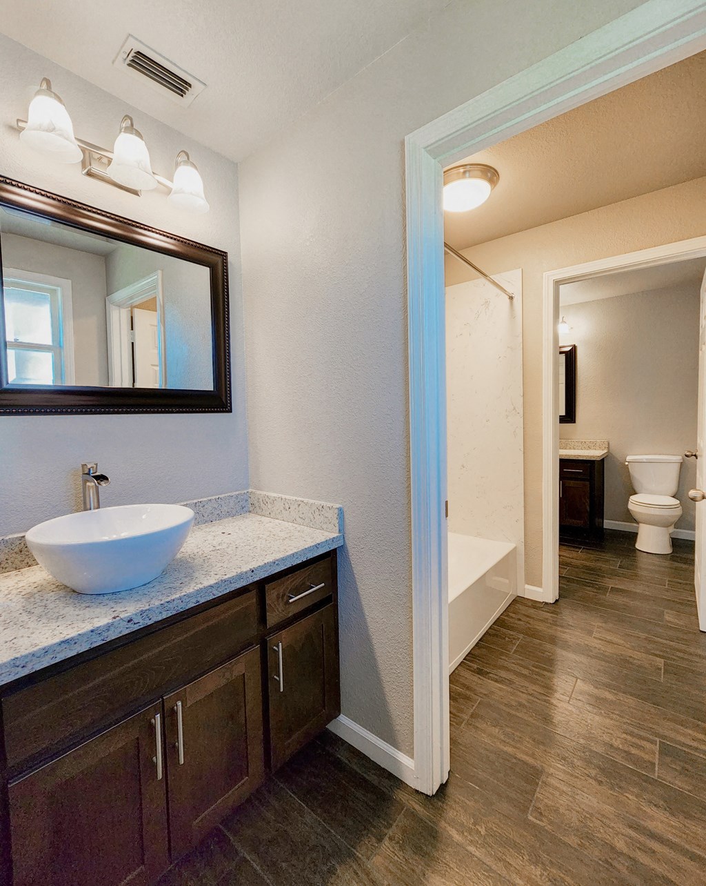 View from adjoining vanity into bathroom