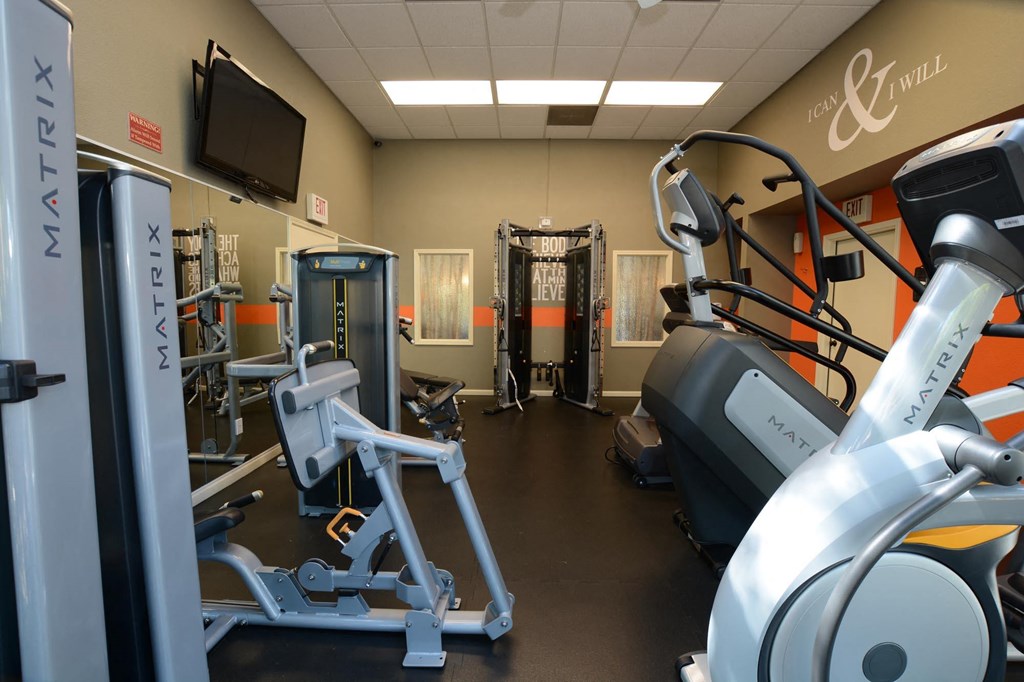 Community fitness center with stair stepper, and weight machine.