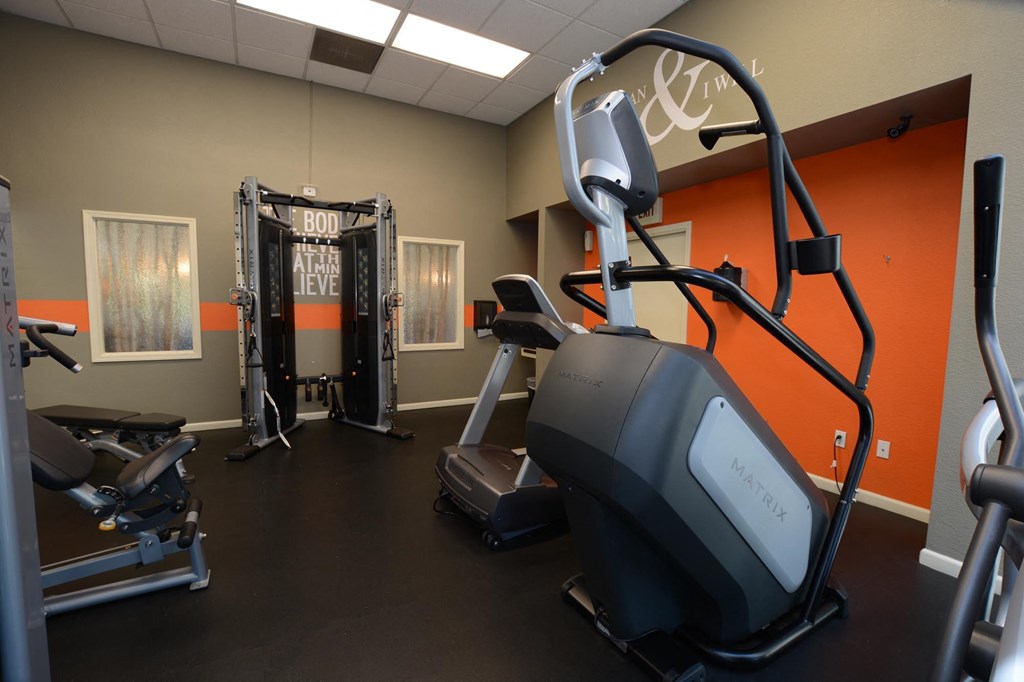 Fitness center at Lake Forest with stair stepper and weight machine