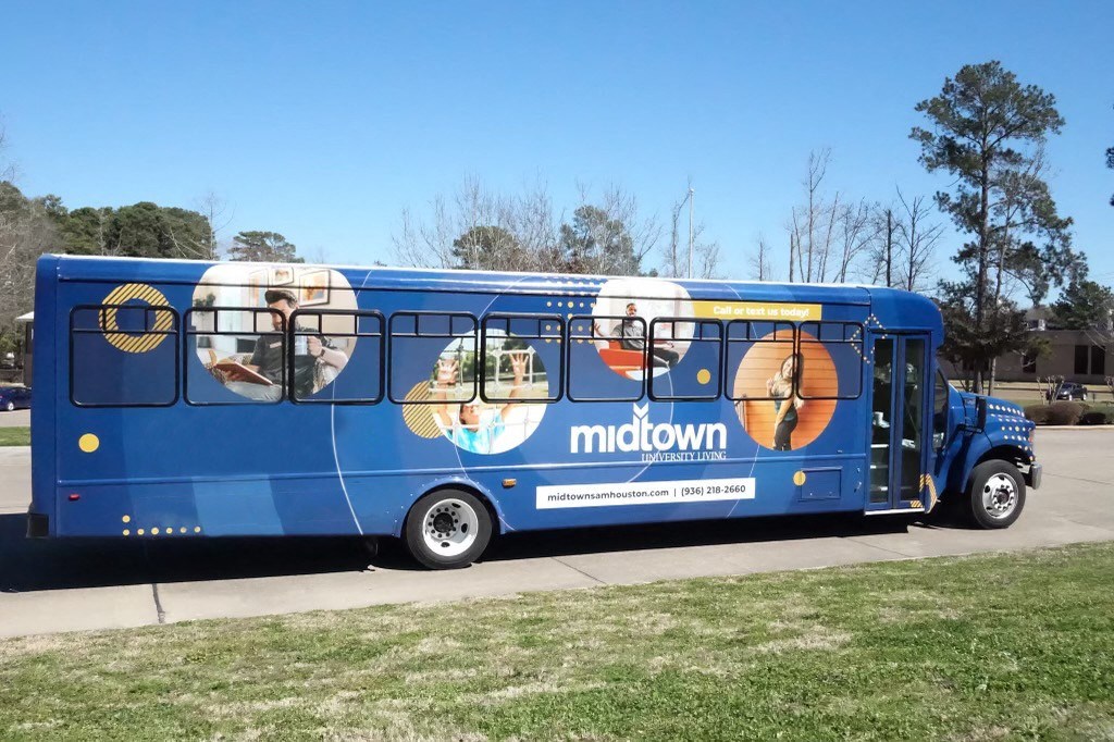 A blue bus at Midtown Sam Houston Apartments, Huntsville, TX