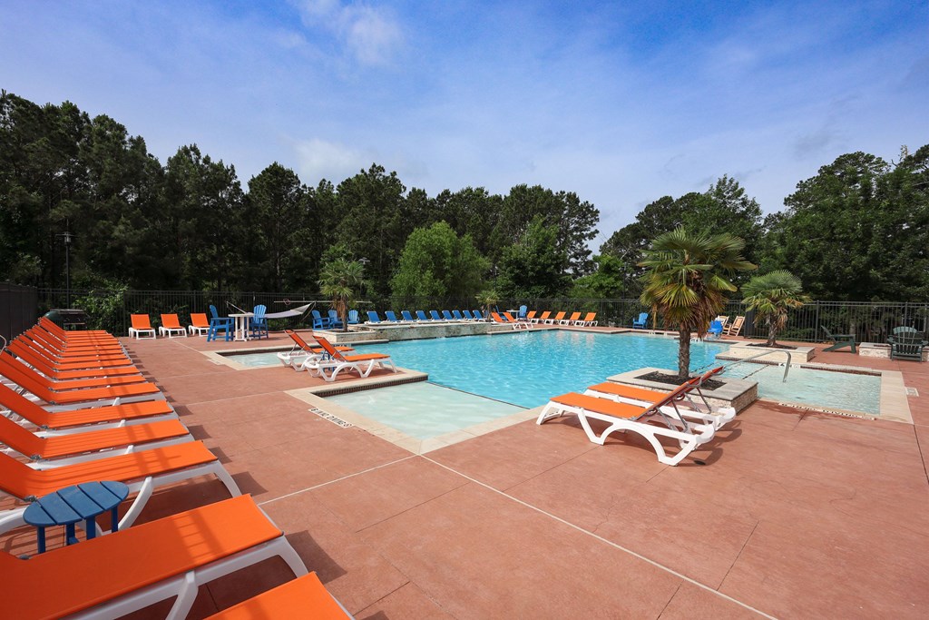 Lounge Swimming Pool With Chairs at Midtown Sam Houston Apartments, Texas