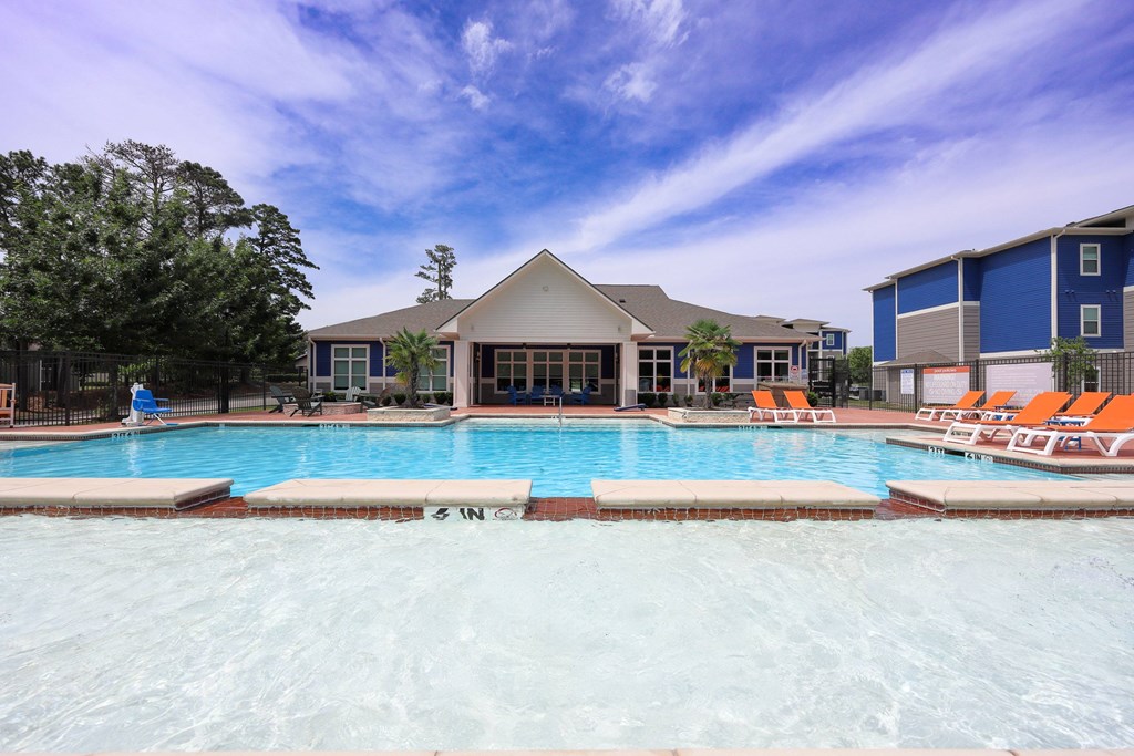 Relaxing Area By The Pool at Midtown Sam Houston Apartments, Huntsville, TX