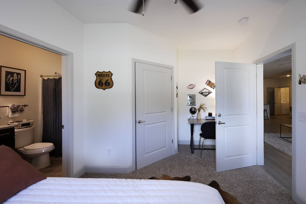 Bedroom Along With Bathroom at Midtown Sam Houston Apartments, Huntsville, Texas