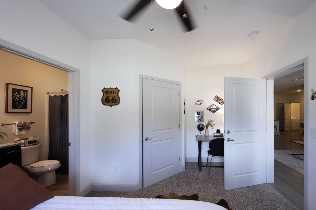 Bedroom Along with Living Room at Midtown Sam Houston Apartments, Huntsville, 77340