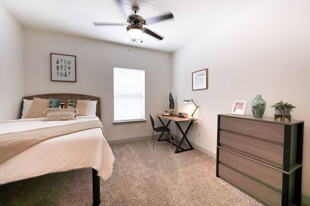 A Small Bedroom at Midtown Sam Houston Apartments, Huntsville, 77340