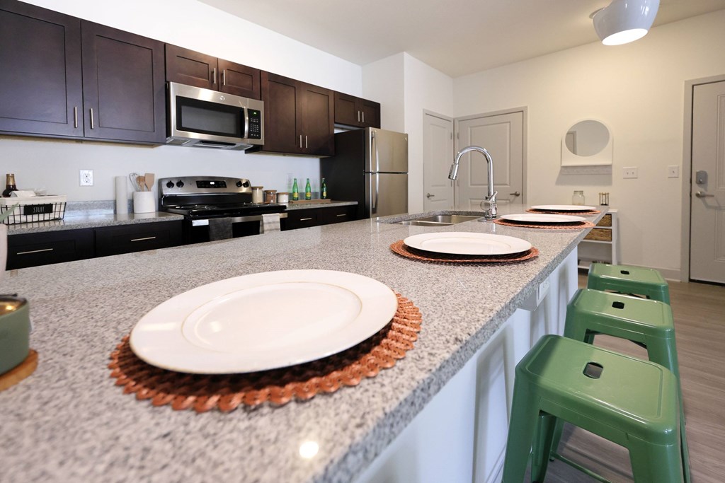 Fully Equipped Eat-In Kitchen at Midtown Sam Houston Apartments, Huntsville, TX
