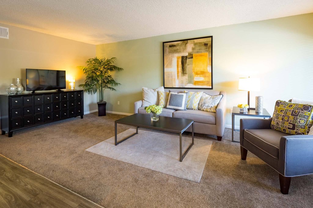 a living room with a couch and a table