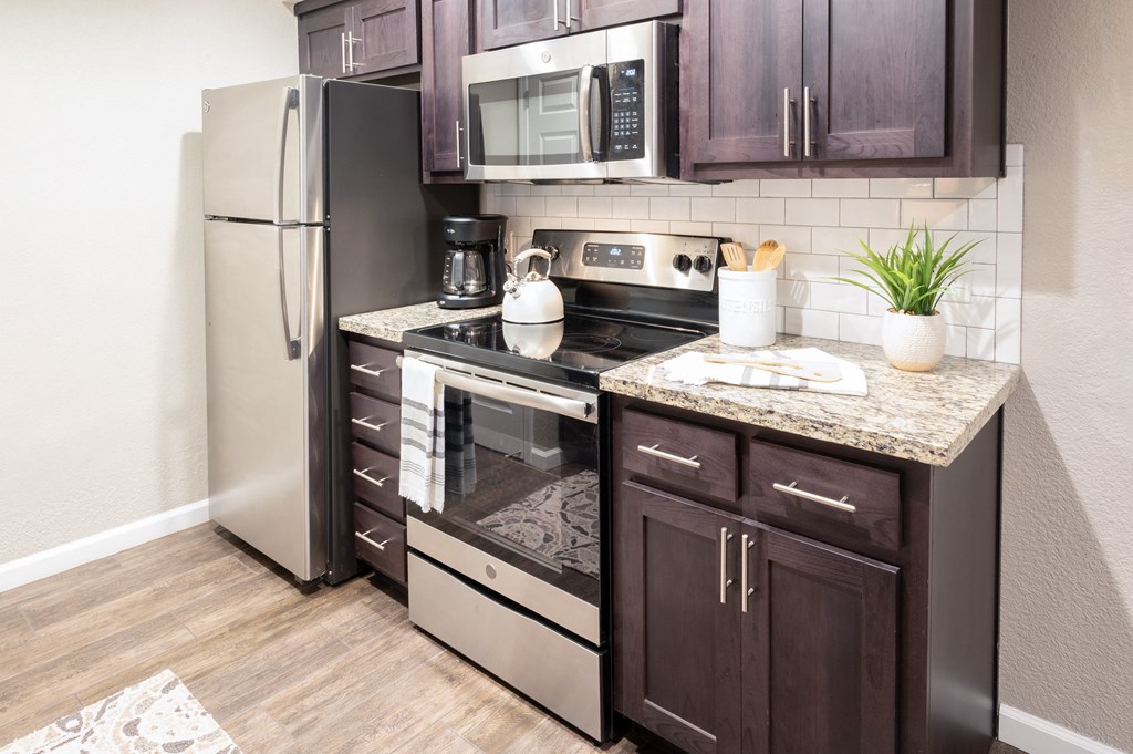 kitchen with stainless appliances and granite counters