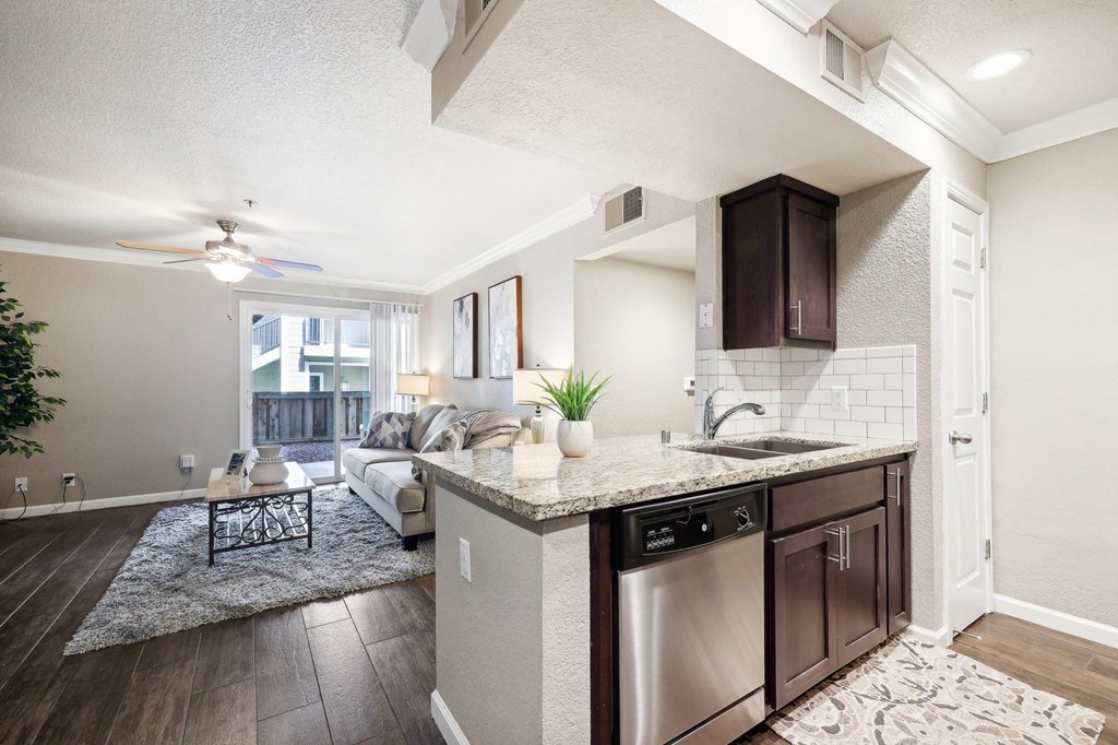 an open floor plan with a kitchen and living room