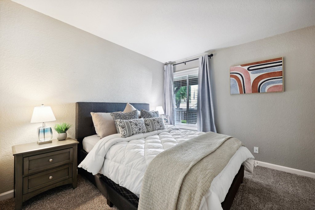 our apartments offer a bedroom with a bed and a window