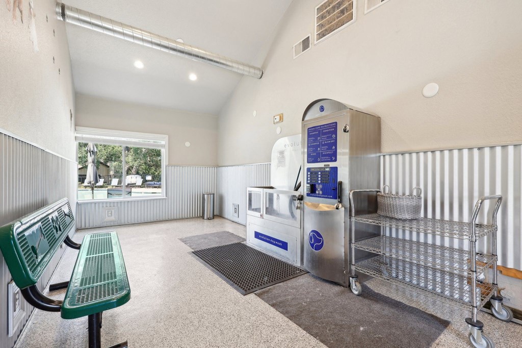 the interior of a building with stainless steel benches and a water fountain