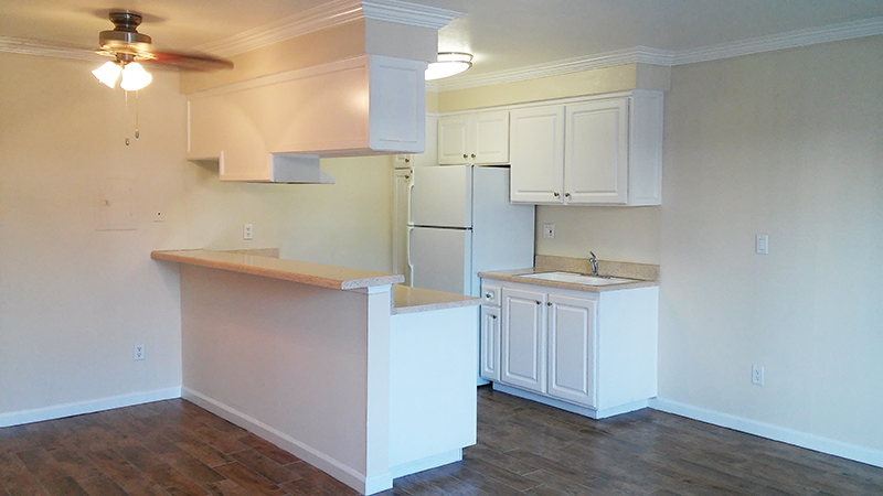 View of kitchen with white cabinets