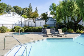 community pool and lounge chairs - Photo Gallery 6