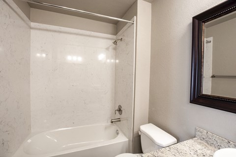 View of bathroom with tub shower combo