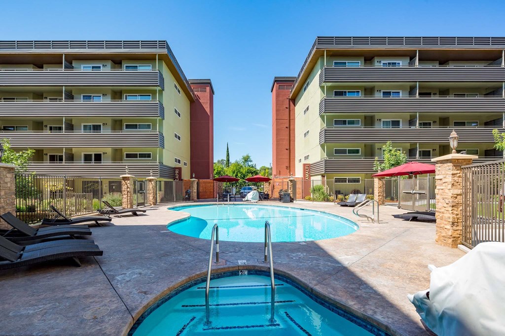 a swimming pool with a building in the background