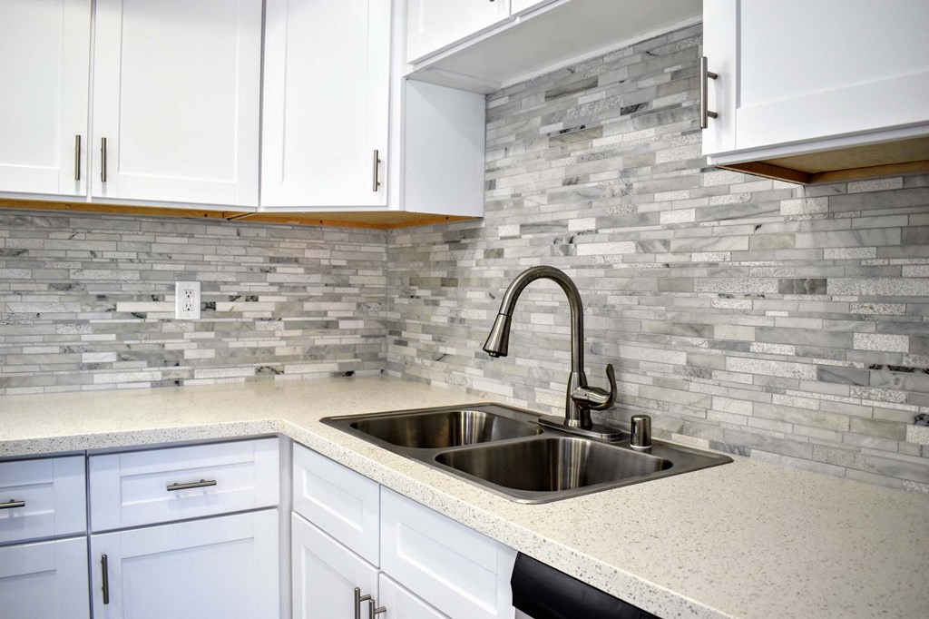 View of kitchen with tile backsplash