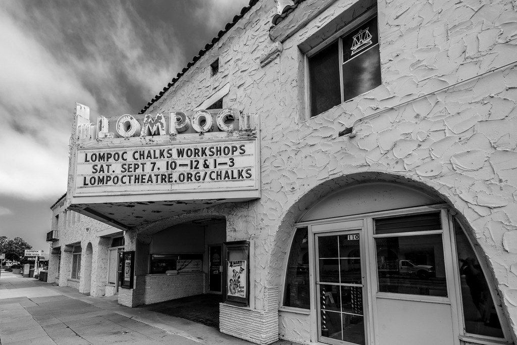a black and white photo of the front of a building