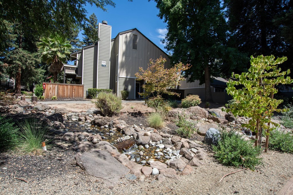 building at selby ranch with small water feature in the foreground