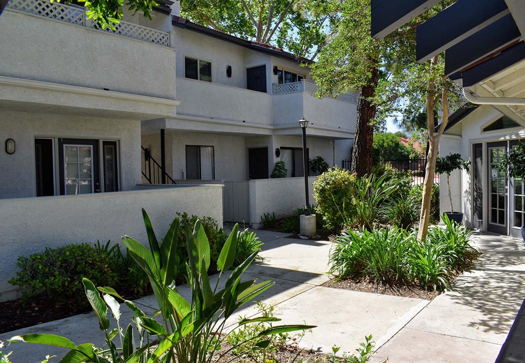 Exterior view of building showing private patios and balconies