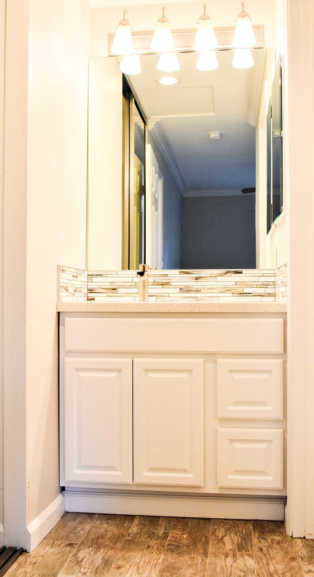 View of well lit bathroom vanity