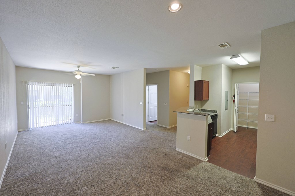 View from dining room into kitchen and living area