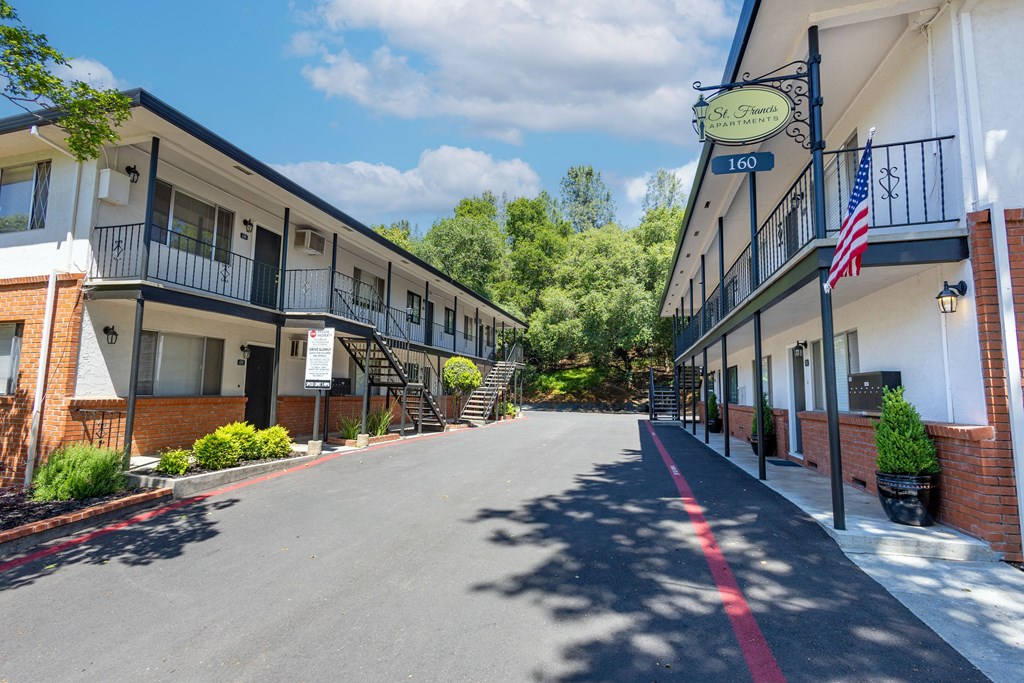 A street view of a building with the number 160 on it.