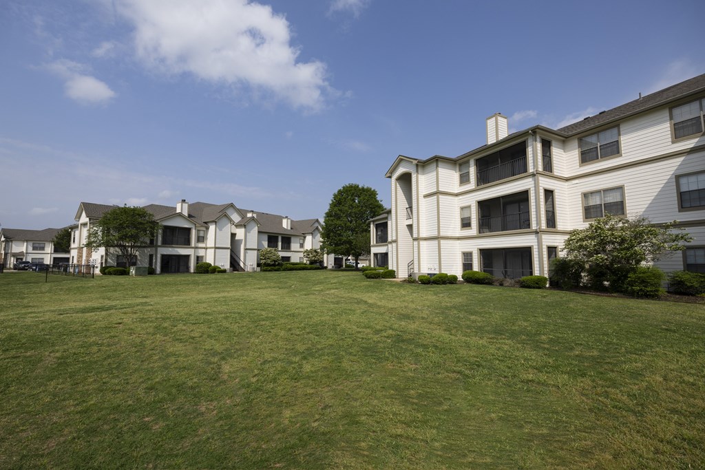 a large lawn in front of apartments