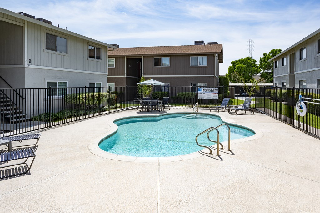 the preserve at ballantyne commons pool with apartment buildings