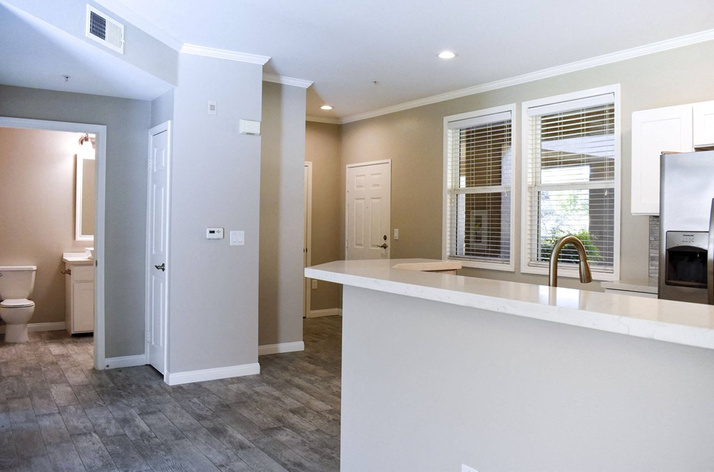 View from living room towards the front door an hall with bathroom