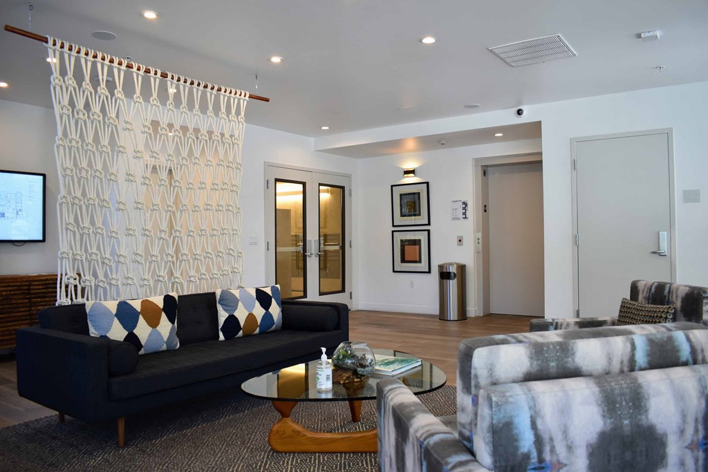 a living room with couches and a coffee table