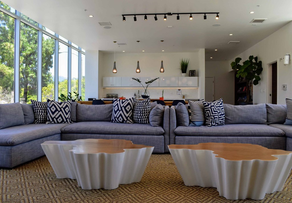 a living room with couches and tables