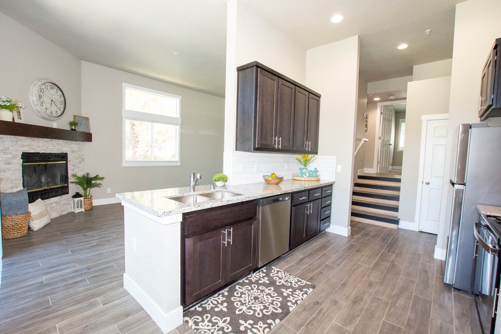 a kitchen with a sink and a stove in a house