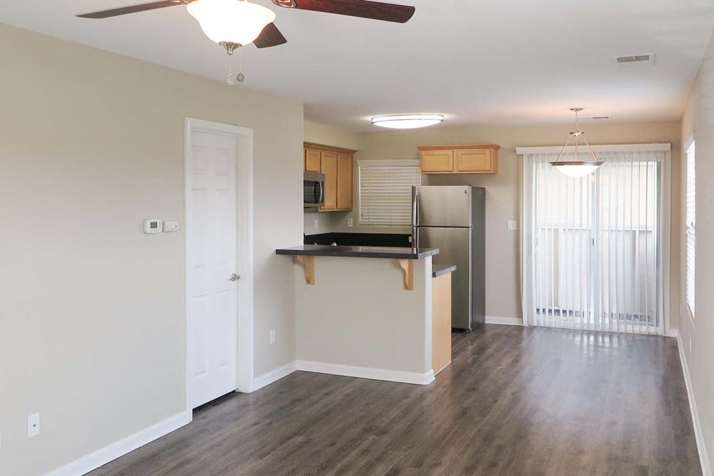 view from living room towards kitchen and patio door