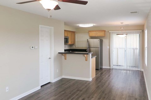 view from living room towards kitchen and patio door