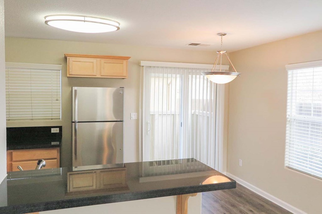 view from living room into kitchen showing wood floors