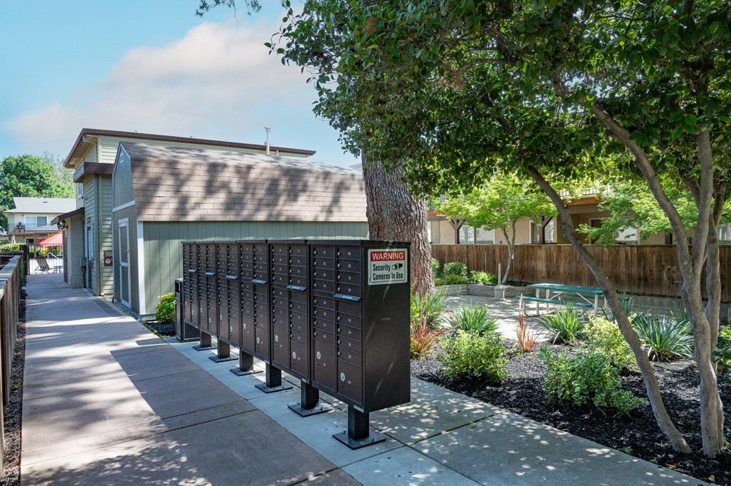View of mail area with courtyard behind and picnic table