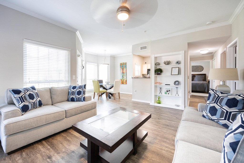 a living room with couches and a coffee table