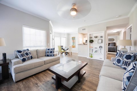 a living room with couches and a coffee table