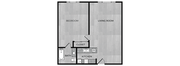 A floor plan of a small apartment with a bedroom, living room, kitchen, and bathroom.