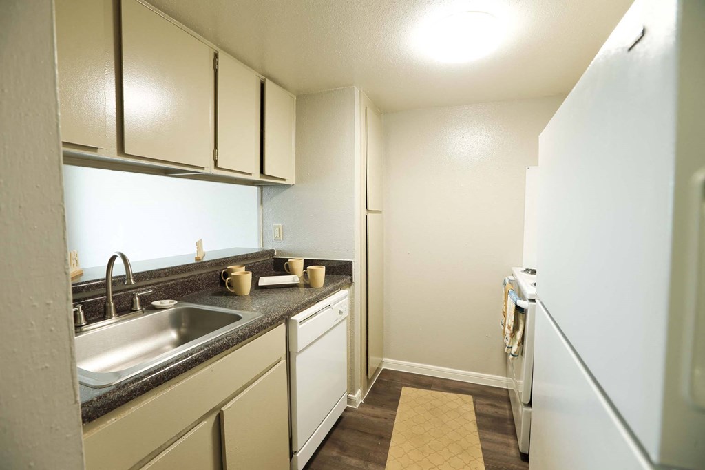 Kitchen view with new appliances at Willow Creek Apartments, Houston, TX, 77012