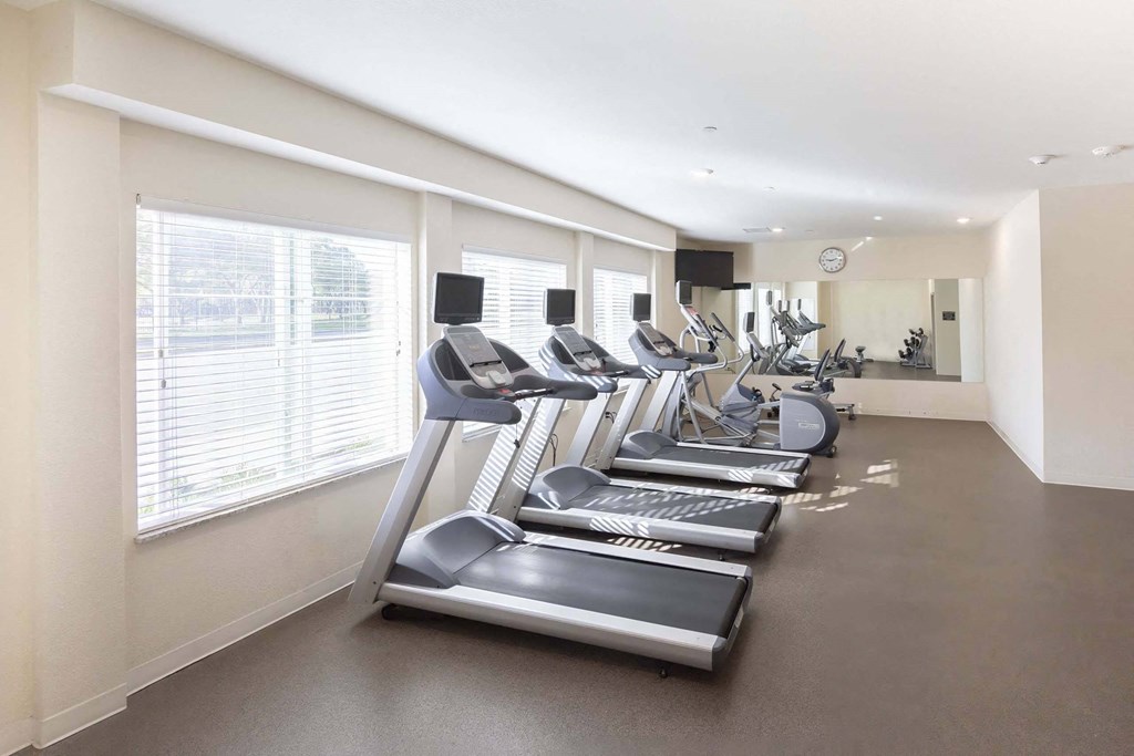 a row of treadmills in a fitness room at Parks Residential - Richardson, Richardson, Texas
