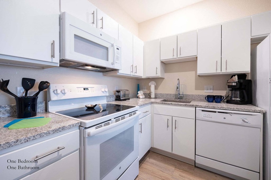a kitchen with pink and purple lights at Parks Residential - Richardson, Texas