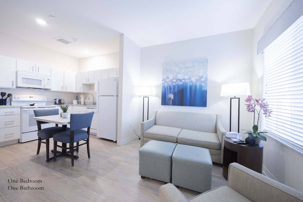 a living room with a couch and a table at Parks Residential - Richardson, Texas