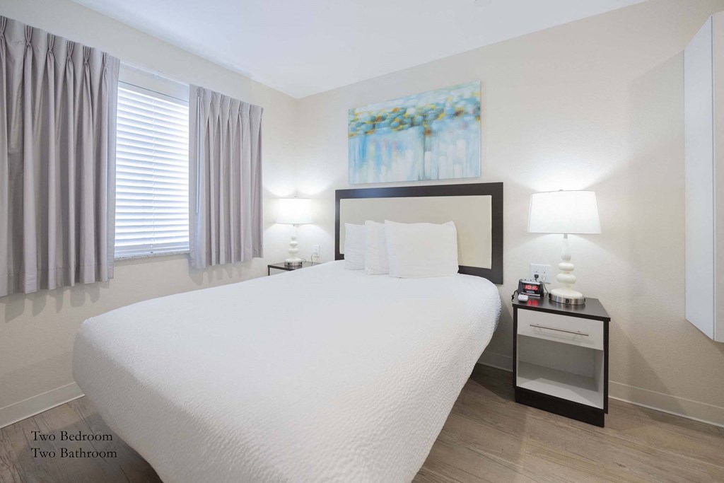 a bedroom with a large white bed and a window at Parks Residential - Richardson, Texas, 75082