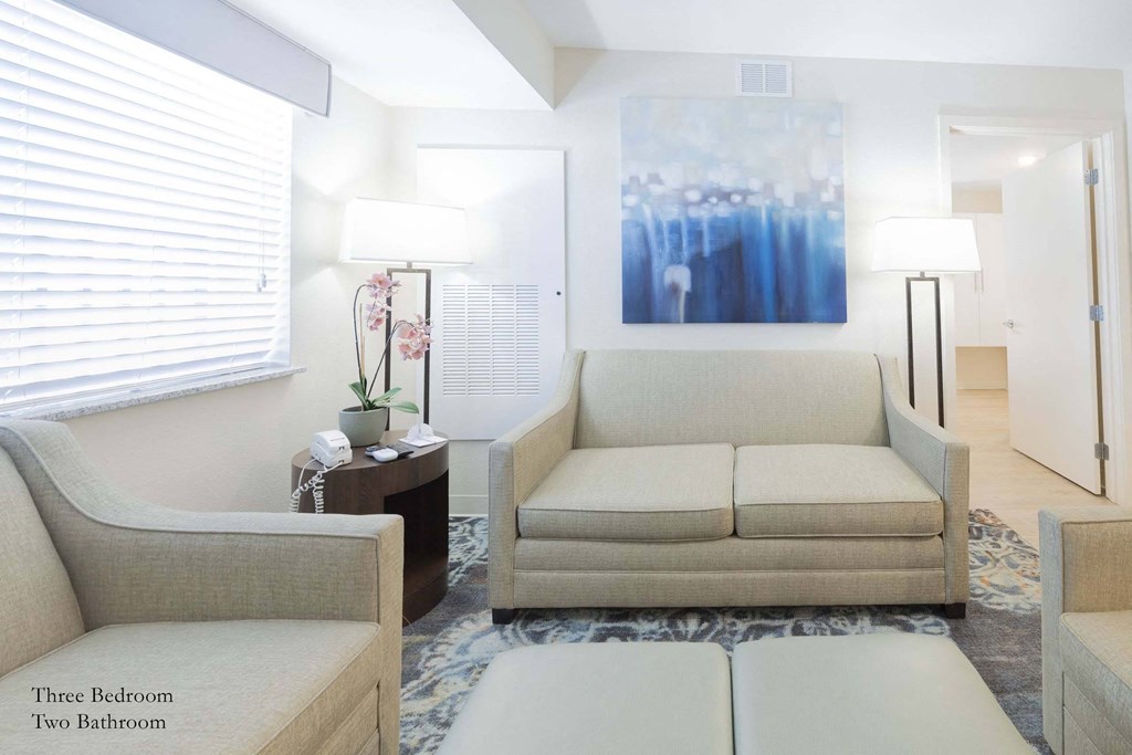 a living room with a couch and a table at Parks Residential - Richardson, Richardson, 75082