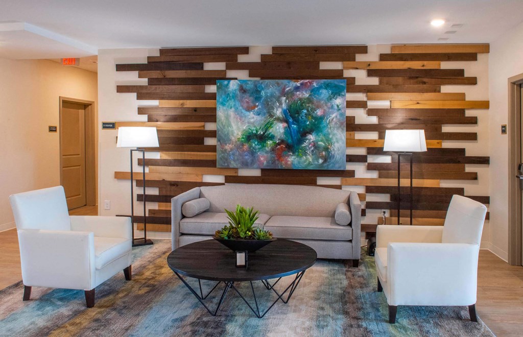 a living room with a couch and a table  at Parks Residential - Richardson, Richardson