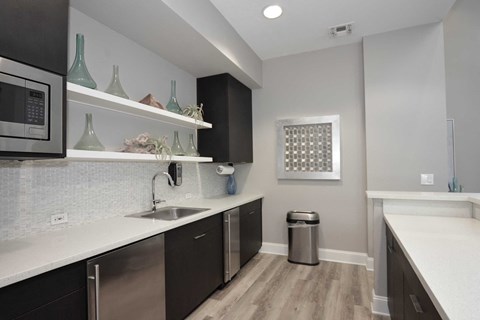 a kitchen with a sink and a microwave